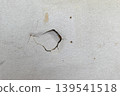 A wall with holes, stains, and dilapidation. 139541518