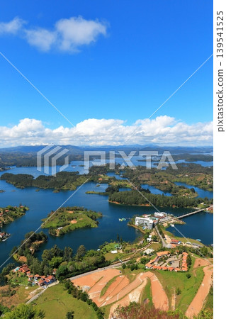 The breathtaking scenery of Lake Guatapé, Colombia: Green islands and blue lake waters as seen from El Peñón. The breathtaking scenery of Lake Guatapé, Colombia: Green islands and blue lake waters as seen from El Peñón. 139541525