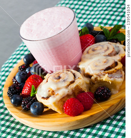 Cinnabons with berry smoothie 139541634