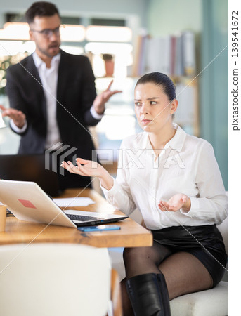 Manager is dissatisfied with the work of an employee - yells and reproaches her Manager is dissatisfied with the work of an employee - yells and reproaches her 139541672