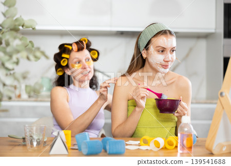 Female friends having pampering day, sharing skincare tips Female friends having pampering day, sharing skincare tips 139541688