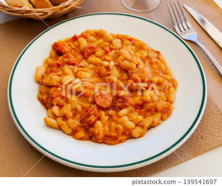 Appetizing braised beans with chorizo sausage pieces 139541697