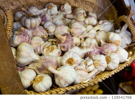 Garlic closeup in basket on market counter Garlic closeup in basket on market counter 139541706