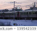 A train running while sparks fly (overhead wire sparks, pantograph sparks) 139542339