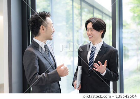 A young businessman conversing with his boss, communicating with clients, and a picture of his career growth through business negotiations. A young businessman conversing with his boss, communicating with clients, and a picture of his career growth through business negotiations. 139542504