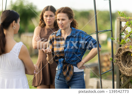 Quarrel between women on farm - disgruntled neighbors sort things out Quarrel between women on farm - disgruntled neighbors sort things out 139542773