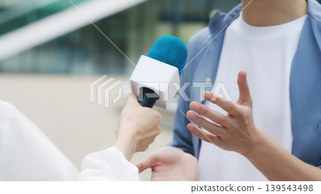A man being interviewed on the street A man being interviewed on the street 139543498