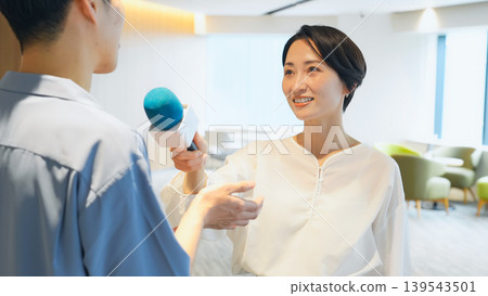 Female reporter conducting the interview 139543501