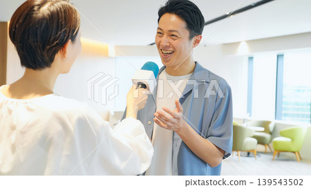 A man receiving an interview A man receiving an interview 139543502