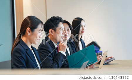Group of business people meeting in an office 139543522