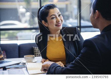 Happy success business woman partner working together in company office corporate executive teamwork. Meeting Executive Asian business woman using laptop office desk with fist arm raised win happiness Happy success business woman partner working together in company office corporate executive teamwork. Meeting Executive Asian business woman using laptop office desk with fist arm raised win happiness 139543793