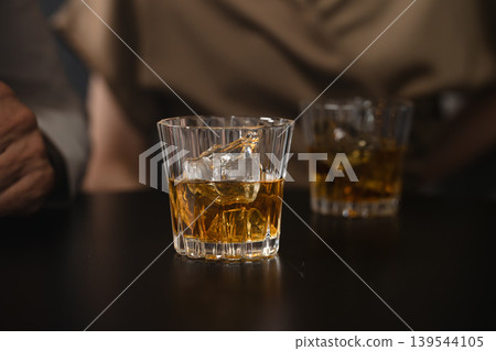 Senior men and women drinking brandy Lifestyle image Senior men and women drinking brandy Lifestyle image 139544105