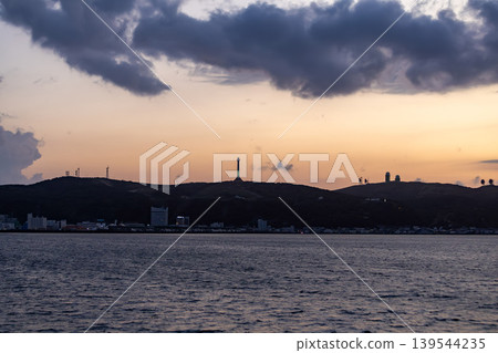 A silhouette view of the Soya Strait and Cape Nosappu at dusk. A silhouette view of the Soya Strait and Cape Nosappu at dusk. 139544235