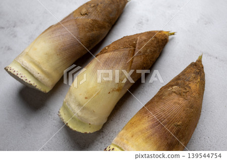 Three bamboo shoots arranged diagonally; an image of spring ingredients. 139544754