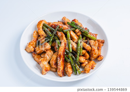 Stir-fried pork loin and garlic sprouts: A hearty meat and vegetable stir-fry (white background) Stir-fried pork loin and garlic sprouts: A hearty meat and vegetable stir-fry (white background) 139544869