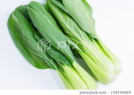Photo of bok choy against a white background. Fresh bok choy vegetable material. Photo of bok choy against a white background. Fresh bok choy vegetable material. 139544964