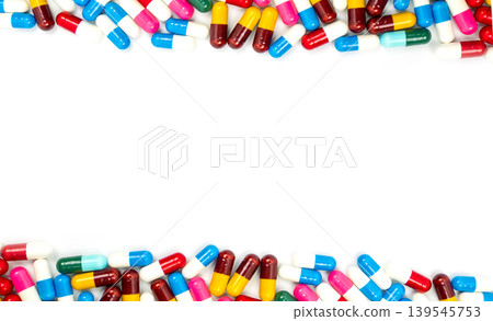 Colorful antibiotic capsules isolated on white background. Antimicrobial resistance and responsible drug use, global healthcare awareness. Infection treatment, safety and pharmaceutical industry. Colorful antibiotic capsules isolated on white background. Antimicrobial resistance and responsible drug use, global healthcare awareness. Infection treatment, safety and pharmaceutical industry. 139545753