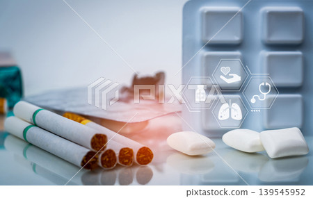 Quit smoking or smoking cessation with nicotine replacement therapy or NRT. 31 May World No Tobacco Day. Nicotine chewing gum in blister pack near pile of cigarettes. Nicotine products to stop smoke. Quit smoking or smoking cessation with nicotine replacement therapy or NRT. 31 May World No Tobacco Day. Nicotine chewing gum in blister pack near pile of cigarettes. Nicotine products to stop smoke. 139545952