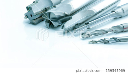 Special tools isolated on white background. Made to order special tools. Coated step drill and reamer detail. HSS cemented carbide. Carbide cutting tool for industrial applications. Engineering tools. Special tools isolated on white background. Made to order special tools. Coated step drill and reamer detail. HSS cemented carbide. Carbide cutting tool for industrial applications. Engineering tools. 139545969