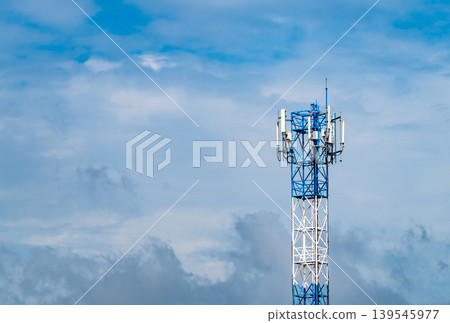 Telecommunication tower with blue sky and white clouds background. Antenna on blue sky. Radio and satellite pole. Communication technology. Telecommunication industry. Mobile or telecom 4g network. Telecommunication tower with blue sky and white clouds background. Antenna on blue sky. Radio and satellite pole. Communication technology. Telecommunication industry. Mobile or telecom 4g network. 139545977
