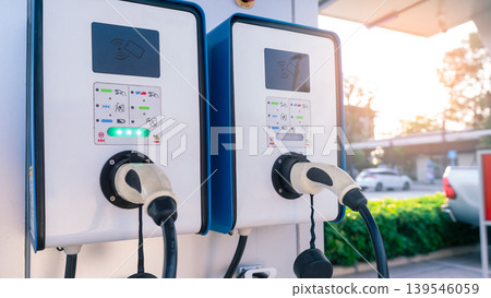 Electric car charging station for charge EV battery. Plug for vehicle with electric and hybrid engine. EV charger. Clean energy. Charging point for EV car. Green power. Future transport technology. 139546059