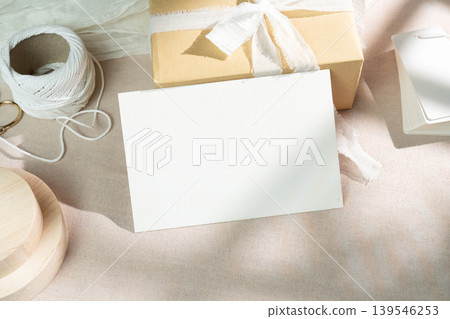 Mockups of a craft gift box and a white greeting card, with clipping paths. Mockups of a craft gift box and a white greeting card, with clipping paths. 139546253
