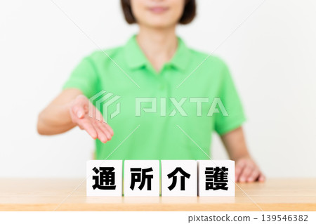 Blocks of day care services and middle-aged female care staff Blocks of day care services and middle-aged female care staff 139546382
