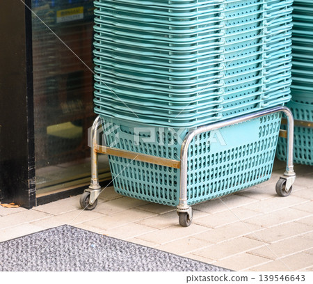 Shopping baskets at the entrance of the supermarket Shopping baskets at the entrance of the supermarket 139546643