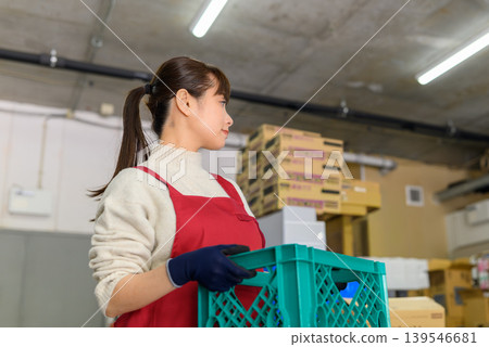 Woman working in a warehouse Woman working in a warehouse 139546681