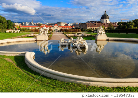 Fountain sculptures in Belvedere Gardens with Lower Belvedere in Vienna, Austria Fountain sculptures in Belvedere Gardens with Lower Belvedere in Vienna, Austria 139547352