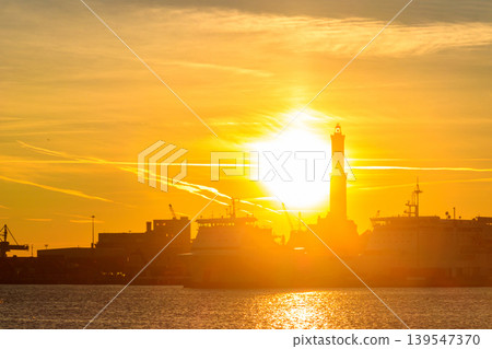 View of Lanterna (lighthouse) in the old port of the city of Genoa at sunset, Italy 139547370