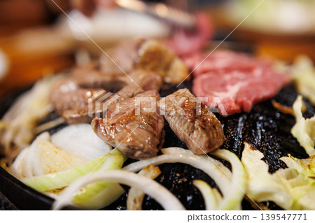 Lamb meat on a hot pot, ready to eat. Lamb meat on a hot pot, ready to eat. 139547771