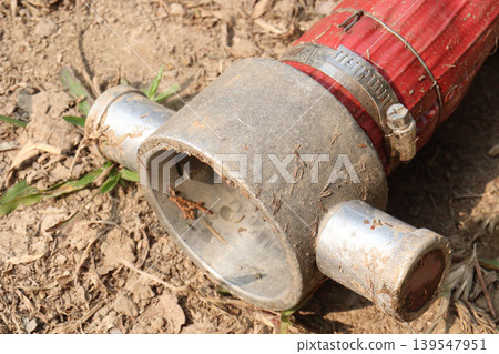 Red colored fire hose equipped with a Storz aluminum coupling, stainless steel clamp Red colored fire hose equipped with a Storz aluminum coupling, stainless steel clamp 139547951