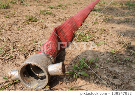 Red colored fire hose equipped with a Storz aluminum coupling, stainless steel clamp Red colored fire hose equipped with a Storz aluminum coupling, stainless steel clamp 139547952