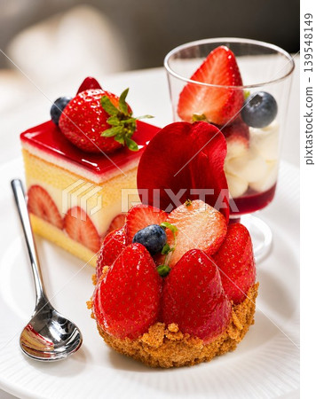 Exquisite strawberry tart dessert plating with blueberry decorations Exquisite strawberry tart dessert plating with blueberry decorations 139548149