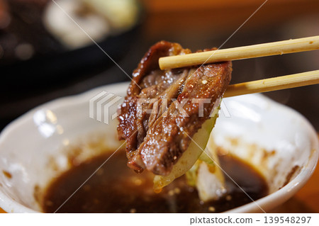 Lamb cooked to perfection in a Genghis Khan hot pot. 139548297
