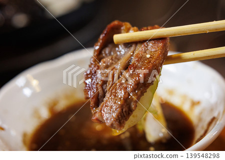 Lamb cooked to perfection in a Genghis Khan hot pot. Lamb cooked to perfection in a Genghis Khan hot pot. 139548298