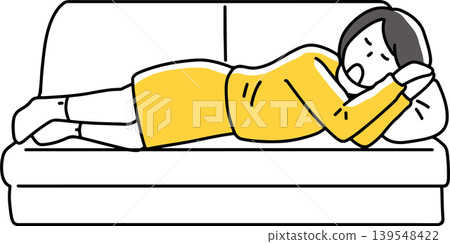 A woman lying down and sleeping on a sofa. A woman lying down and sleeping on a sofa. 139548422