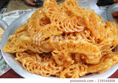 Jalebi is a common sweet snack in the Indian subcontinent Jalebi is a common sweet snack in the Indian subcontinent 139548806