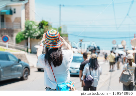 Woman tourist Visiting in Kamakura, Kanagawa, Japan. happy Traveler sightseeing Kamakurakokomae train station. Landmark and popular for tourists attraction near Tokyo. Travel and Vacation concept 139548990