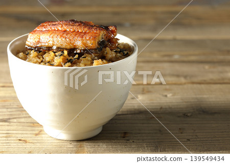 A single photo of a mini eel rice bowl. A single photo of a mini eel rice bowl. 139549434