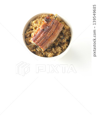 A mini eel rice bowl photographed alone against a white background. A mini eel rice bowl photographed alone against a white background. 139549685