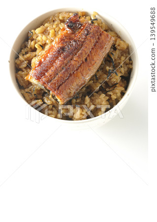 A mini eel rice bowl photographed alone against a white background. 139549688