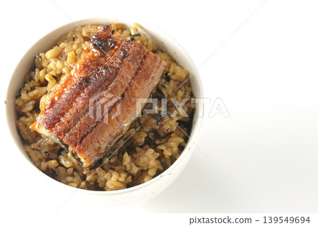 A mini eel rice bowl photographed alone against a white background. 139549694