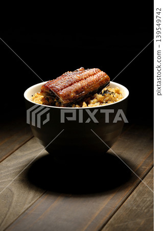 A single photo of a mini eel rice bowl. A single photo of a mini eel rice bowl. 139549742
