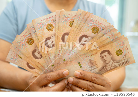 Asian woman counting Thai baht banknote money, investment economy, accounting business and banking. 139550546