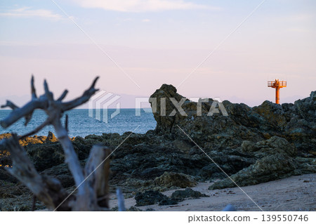 A tranquil coastal landscape enveloped in twilight. A tranquil coastal landscape enveloped in twilight. 139550746