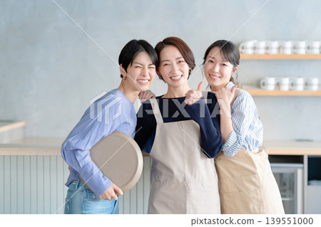 A woman working in a cafe 139551000