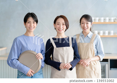 A woman working in a cafe A woman working in a cafe 139551002