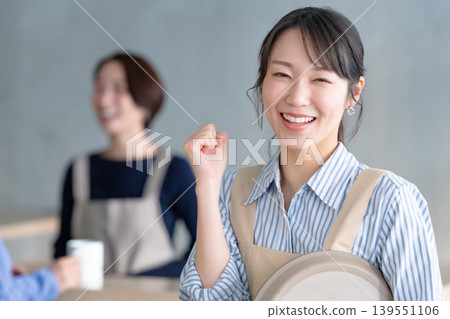 Clerk in cafe doing guts pose 139551106